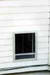 dog_house_fence__pet_door_2002_door_from_outside.jpg (77857 bytes)